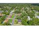 Aerial neighborhood shot featuring tree-lined streets, mature landscaping, and single-Gathering homes at 1210 Heidi S Ln, Lakeland, FL 33813