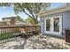 Back deck with outdoor seating and a large tree creating lots of shade at 1210 Heidi S Ln, Lakeland, FL 33813