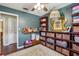 Spacious bedroom featuring hardwood floors, ample storage, and a charming decor at 1210 Heidi S Ln, Lakeland, FL 33813
