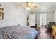 Bright bedroom features wood floors and connecting doors to the bathroom and living area at 1210 Heidi S Ln, Lakeland, FL 33813
