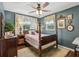 Comfortable bedroom with hardwood floors, bright windows, and cozy decor at 1210 Heidi S Ln, Lakeland, FL 33813
