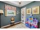 Comfortable bedroom with hardwood floors, bright window, and whimsical decor at 1210 Heidi S Ln, Lakeland, FL 33813