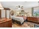 Cozy bedroom with a mix of vintage and modern furnishings and unique decorative elements at 1210 Heidi S Ln, Lakeland, FL 33813