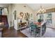 Bright dining room adjacent to the living area features chandelier lighting at 1210 Heidi S Ln, Lakeland, FL 33813