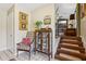 Welcoming foyer with tiled floor and stairs to an upper-level living area at 1210 Heidi S Ln, Lakeland, FL 33813