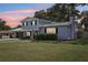 Charming two-story home with an attached two-car garage and a manicured lawn at 1210 Heidi S Ln, Lakeland, FL 33813