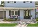 Inviting front porch with comfortable seating and stylish decor at 1210 Heidi S Ln, Lakeland, FL 33813