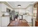 Bright kitchen features stainless steel appliances, granite countertops, and hardwood floors at 1210 Heidi S Ln, Lakeland, FL 33813