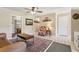 Comfortable living room featuring tile floors, ceiling fan, decorative rug, and stylish furnishings at 1210 Heidi S Ln, Lakeland, FL 33813
