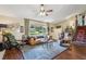 Spacious living room with natural light, vaulted ceiling, and stylish decor at 1210 Heidi S Ln, Lakeland, FL 33813