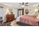 Spacious main bedroom with wood floors, neutral walls, ceiling fan and decorative accents at 1210 Heidi S Ln, Lakeland, FL 33813