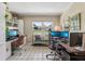 Well-lit office space with tile floors, built-in shelving, and multiple workstations at 1210 Heidi S Ln, Lakeland, FL 33813