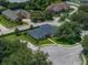 Well-maintained home with lush lawn, complementing shrubbery and mature trees, manicured cul-de-sac at 128 Melissa Trl, Auburndale, FL 33823