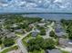 Lovely single Gathering home with verdant landscaping and dark roof; lakeside community at 128 Melissa Trl, Auburndale, FL 33823