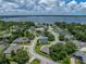 Lovely single Gathering home with verdant landscaping and dark roof; lakeside community at 128 Melissa Trl, Auburndale, FL 33823