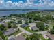 Lovely single Gathering home with verdant landscaping and dark roof; lakeside community at 128 Melissa Trl, Auburndale, FL 33823