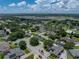 Lovely single Gathering home with verdant landscaping and dark roof; residential community at 128 Melissa Trl, Auburndale, FL 33823