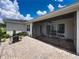 Brick patio with a built-in grill, providing an ideal setting for outdoor gatherings at 128 Melissa Trl, Auburndale, FL 33823
