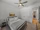 Cozy bedroom featuring a comfortable bed, ceiling fan, and ample closet space at 128 Melissa Trl, Auburndale, FL 33823