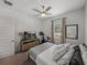 Bright bedroom featuring a ceiling fan, natural light, and exercise bike at 128 Melissa Trl, Auburndale, FL 33823