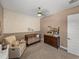 Well-lit Bedroom with floral accent wall, crib, dresser, and comfy chair at 128 Melissa Trl, Auburndale, FL 33823