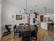 Open-concept dining room and kitchen provide an ideal space for entertaining guests and Gathering at 128 Melissa Trl, Auburndale, FL 33823