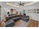Expansive living space features wood floors, open layout, and abundant natural light at 128 Melissa Trl, Auburndale, FL 33823