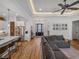 Spacious open-concept living room with wood floors connecting to the kitchen at 128 Melissa Trl, Auburndale, FL 33823