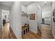 Mudroom features a built-in bench with storage, coat hooks, and convenient access to laundry room at 128 Melissa Trl, Auburndale, FL 33823