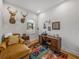 Comfortable office with deer heads, wood desk, colorful rug, and window at 128 Melissa Trl, Auburndale, FL 33823