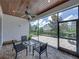 Relaxing screened-in patio with brick floors, wood ceiling, ceiling fan, and outdoor seating at 128 Melissa Trl, Auburndale, FL 33823