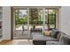 Outdoor patio with seating, accessed through sliding glass doors from the living room at 128 Melissa Trl, Auburndale, FL 33823