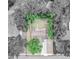 Aerial view highlighting the property lines with its fenced backyard and mature trees at 132 Kinstle Ave, Auburndale, FL 33823