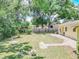 Expansive backyard featuring a well-maintained lawn, providing a serene outdoor retreat at 132 Kinstle Ave, Auburndale, FL 33823