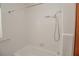 Clean, bright bathroom showcasing a tub and a tiled shower with updated fixtures at 132 Kinstle Ave, Auburndale, FL 33823