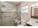 Modern bathroom with a glass shower and updated fixtures at 132 Kinstle Ave, Auburndale, FL 33823
