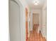 Hallway with hardwood floors and a light fixture at 132 Kinstle Ave, Auburndale, FL 33823