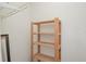 A simple wooden shelf in a room with white walls at 132 Kinstle Ave, Auburndale, FL 33823
