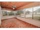 Charming sunroom with beautiful wood ceilings, unique tile floor, and plenty of natural light at 132 Kinstle Ave, Auburndale, FL 33823