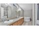 Bathroom with double sinks, a soaking tub, and neutral floral wallpaper at 15345 Angus Rd, Polk City, FL 33868