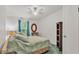 Comfortable bedroom with a ceiling fan and large window at 15345 Angus Rd, Polk City, FL 33868