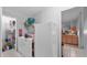 A practical laundry room with washer, dryer, and storage shelves for organization at 15345 Angus Rd, Polk City, FL 33868
