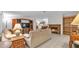 Bright living room features tile floors, fireplace, built-in shelving, and open floor plan at 15345 Angus Rd, Polk City, FL 33868
