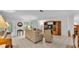 Spacious living room with neutral tones, tile flooring, and an open view of the front entry at 15345 Angus Rd, Polk City, FL 33868