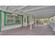 Spacious covered porch perfect for outdoor gatherings and relaxation at 15345 Angus Rd, Polk City, FL 33868