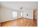Inviting bedroom with hardwood floors and ceiling fan at 1610 Reynolds Rd # 214, Lakeland, FL 33801