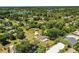 A captivating aerial shot of a neighborhood filled with mature trees, charming homes, and proximity to local amenities at 1720 Park Dr, Lakeland, FL 33803