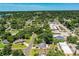 Expansive aerial view showcases the neighborhood's lush greenery and proximity to local shops and dining at 1720 Park Dr, Lakeland, FL 33803