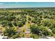 Overhead shot shows neighborhood streets, mature trees, and community near a lake creating a serene atmosphere at 1720 Park Dr, Lakeland, FL 33803