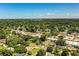 Overhead view showcases neighborhood streets, mature trees, and community near local shops creating a relaxed atmosphere at 1720 Park Dr, Lakeland, FL 33803